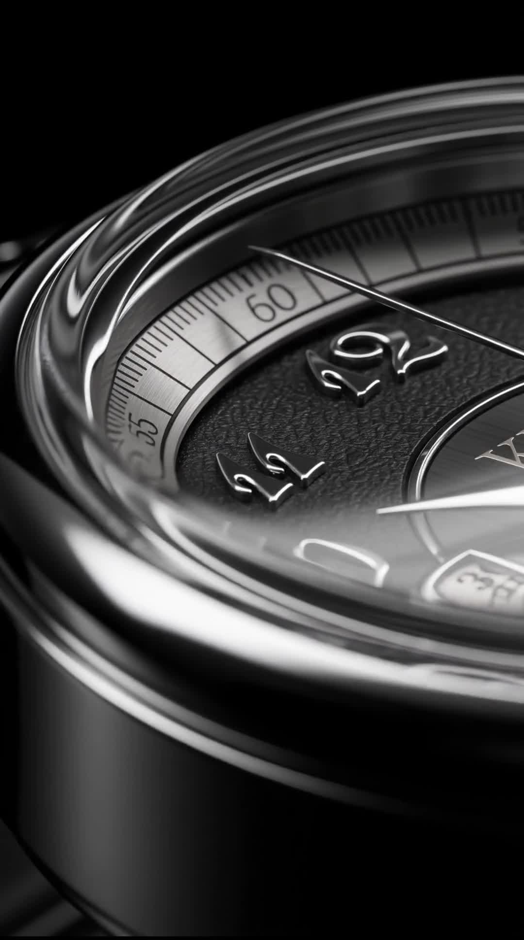 Macro rotation of steel watch case under studio light